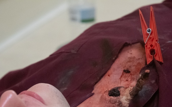 Simulated corpse gets tagged as deceased by 932nd airmen