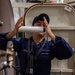 USS Ronald Reagan (CVN 76) Sailors and contractors conduct deck refinishing