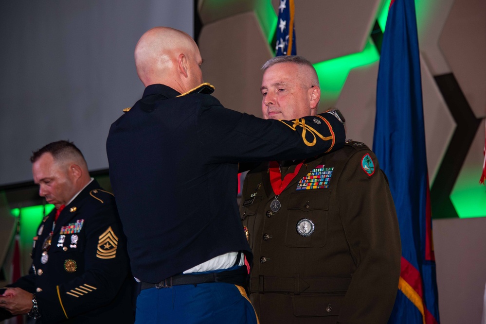 Task Force Talon Commander presents Order of Saint Barbara to recipients during the Army’s 250th Birthday Ball