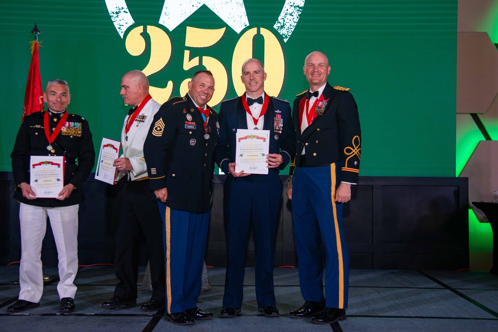 Task Force Talon Commander presents Order of Saint Barbara to recipients during the Army’s 250th Birthday Ball