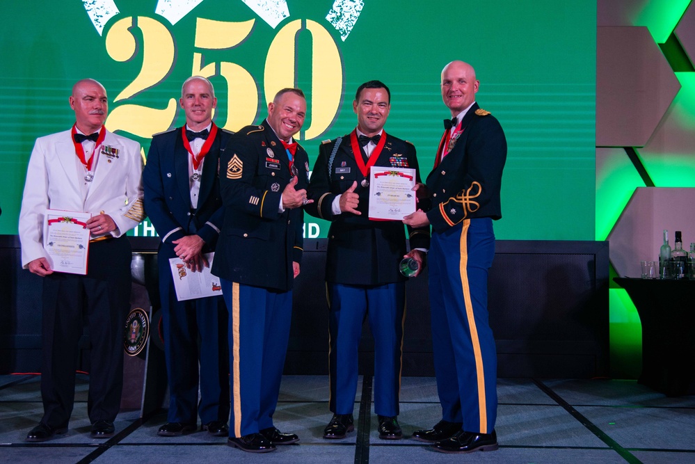 Task Force Talon Commander presents Order of Saint Barbara to recipients during the Army’s 250th Birthday Ball