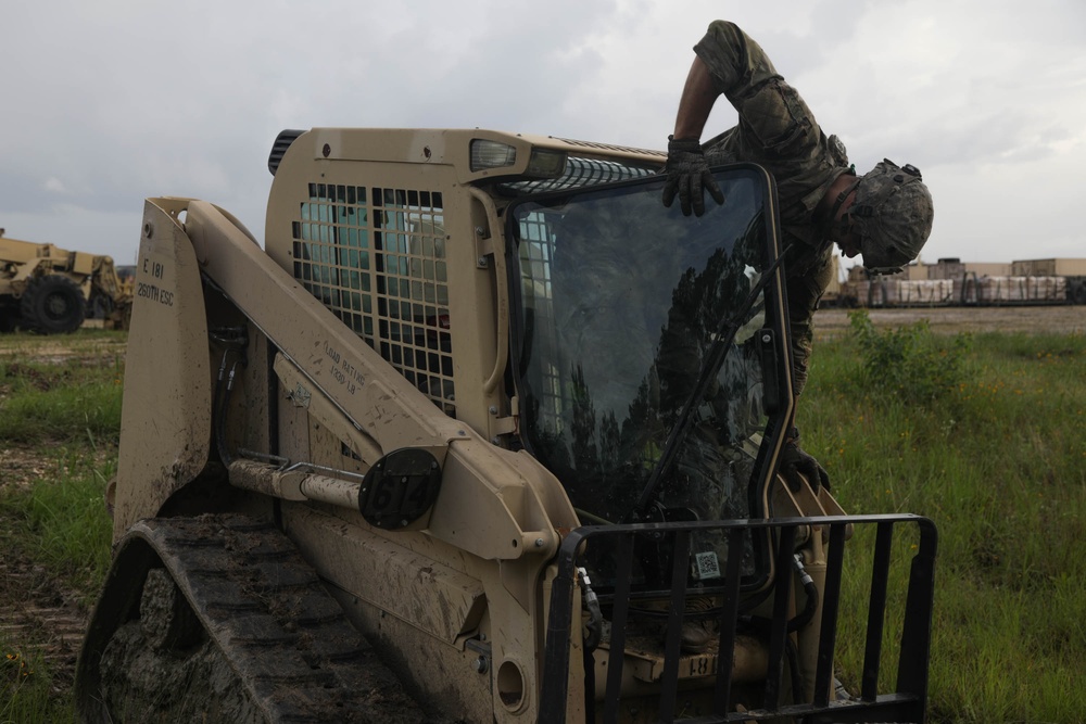 Soldier operates forklift to fortify position at JRTC
