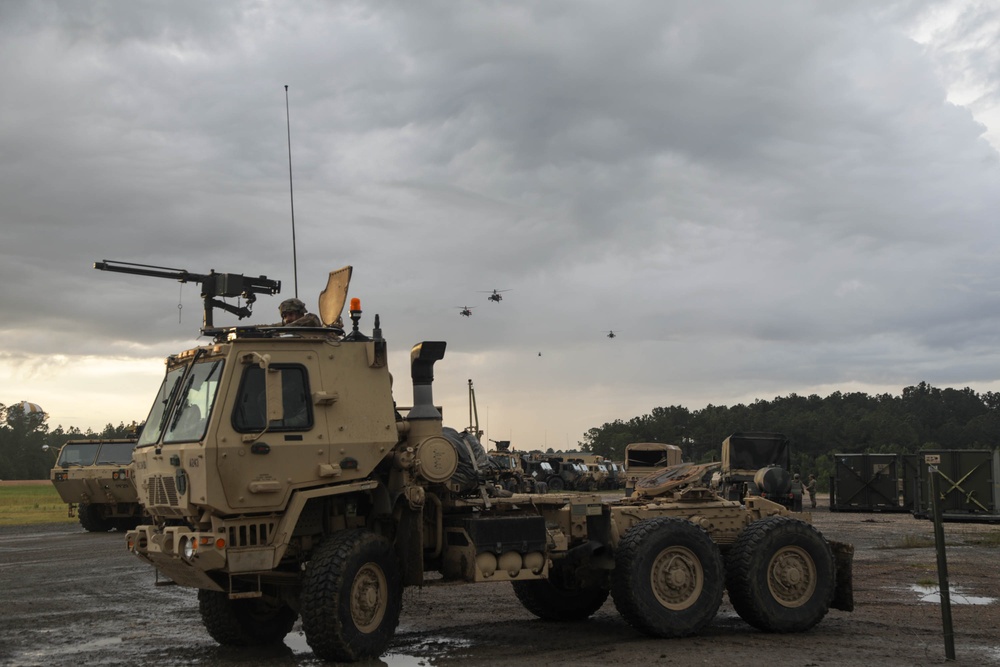 Apache Helicopters fly over BSA at JRTC