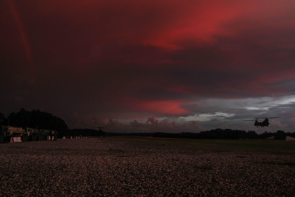 Chinook helicopter flying at sunset at JRTC