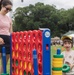 A mother and her son play Connect 4 at the 250th U.S. Army Birthday Festival