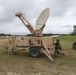 Soldier works on satellite communications at JRTC