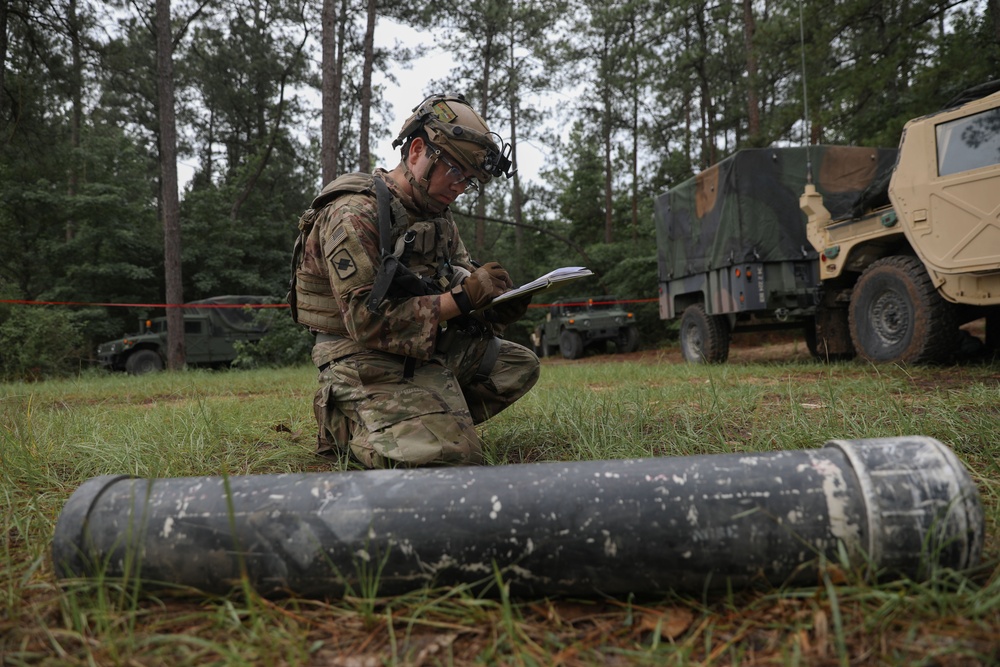 Soldier inspects a dropped missile at JRTC