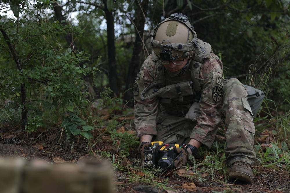 Soldier inspects a dropped missile at JRTC
