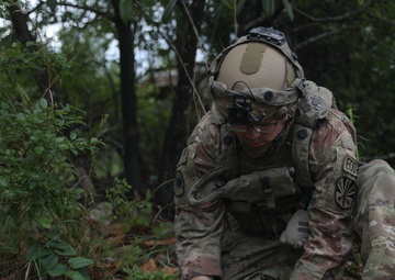 Soldier inspects a dropped missile at JRTC