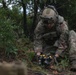 Soldier inspects a dropped missile at JRTC