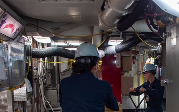 USS Ronald Reagan (CVN 76) Sailors Move Pallets Through Mess Decks