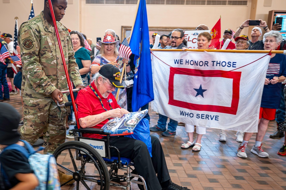 Members of Team Kirtland welcome home veterans of the Honor Flight