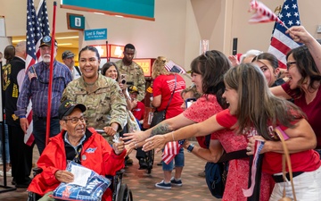 Members of Team Kirtland welcome home veterans of the Honor Flight
