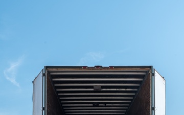 Airmen offload luggage at Aviano Air Base, Italy