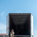 Airmen offload luggage at Aviano Air Base, Italy