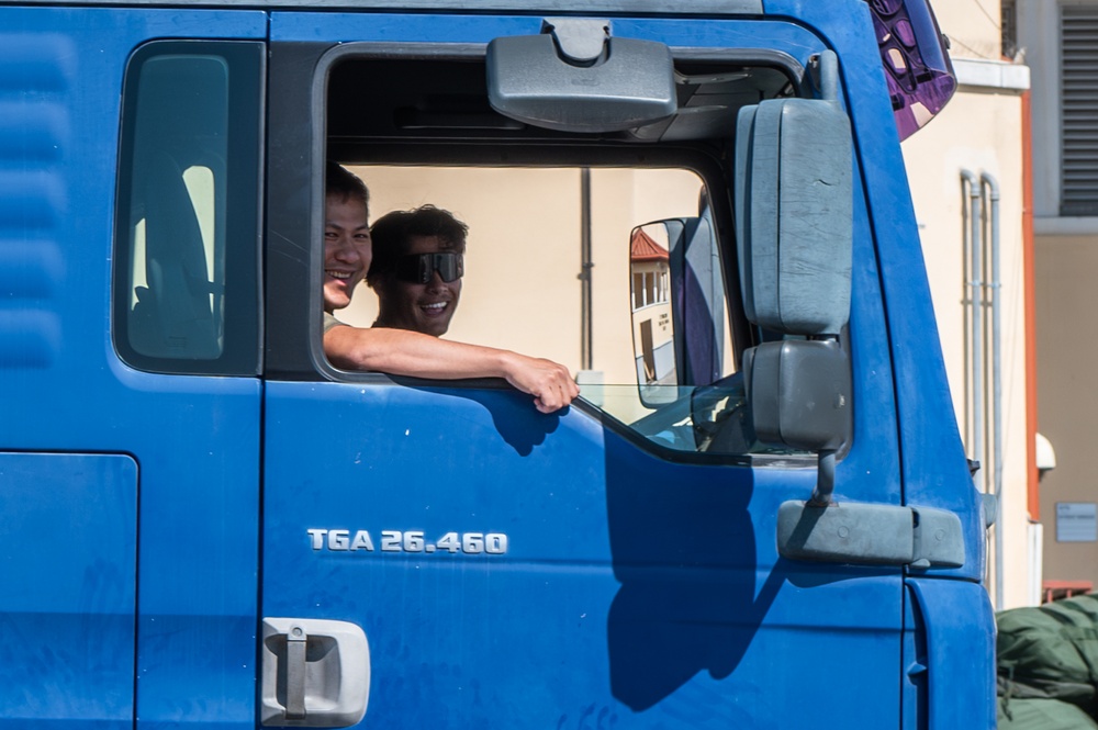 Airmen offload luggage at Aviano Air Base, Italy