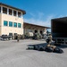 Airmen offload luggage at Aviano Air Base, Italy
