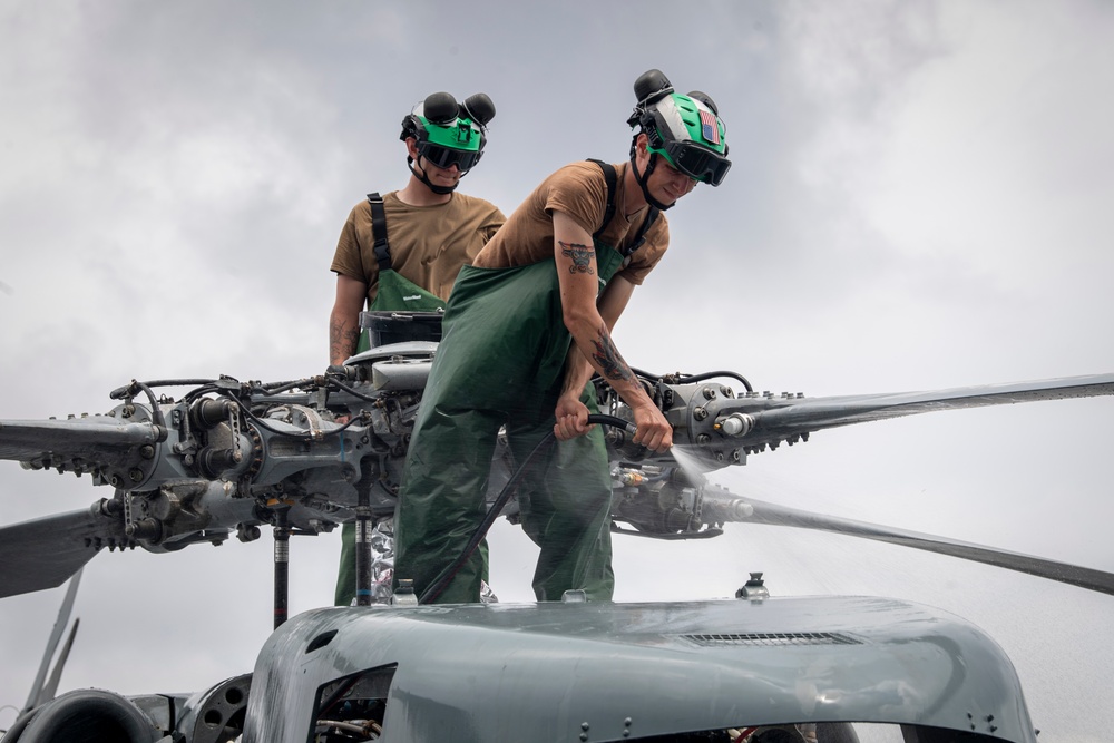 Sailors wash helicopter