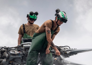 Sailors wash helicopter