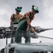 Sailors wash helicopter