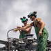 Sailors wash helicopter