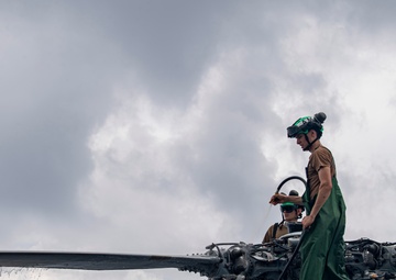Sailors wash helicopter