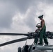 Sailors wash helicopter