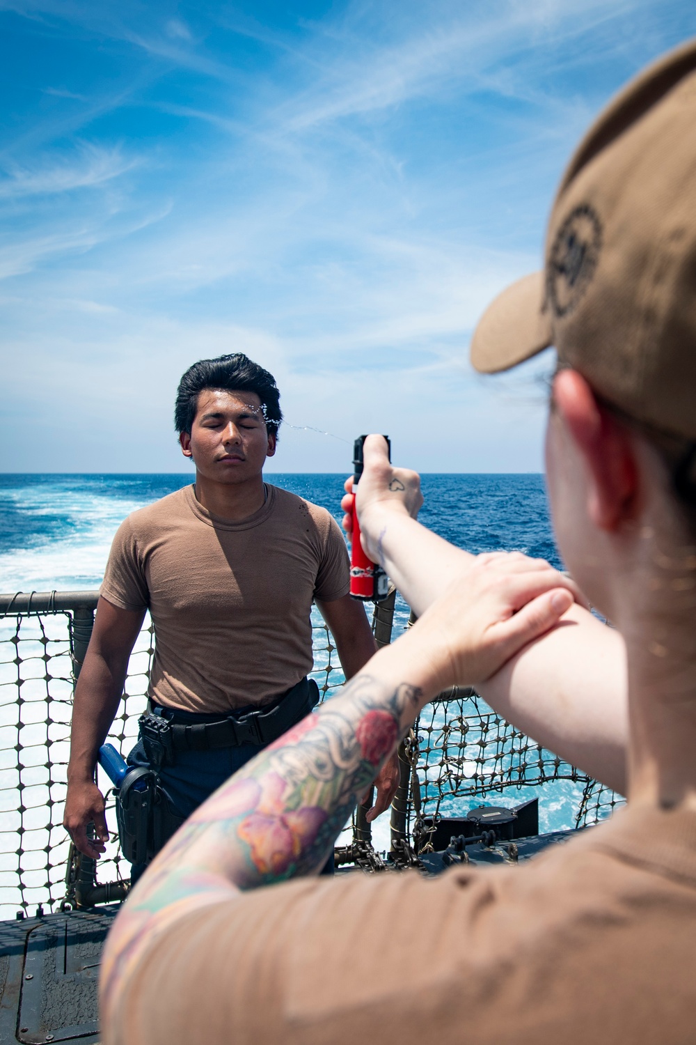 Sailors participate in OC spray course