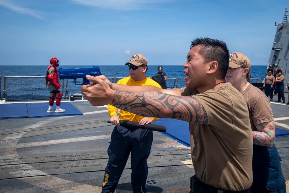 Sailors participate in OC spray course