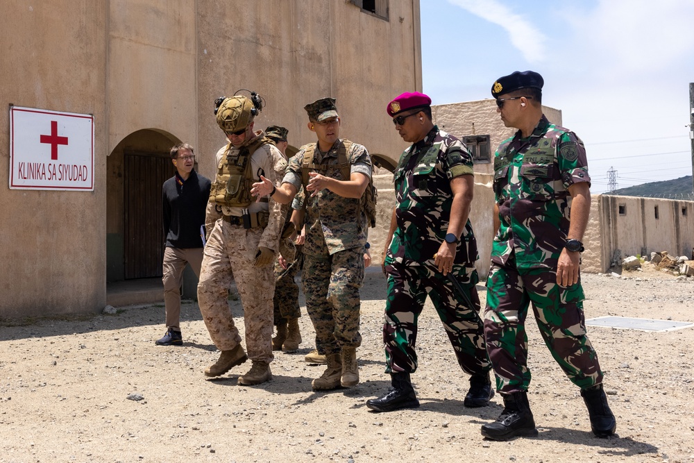 U.S. Marines and Indonesian Korps Marinir perform air raids at the infantry immersion trainer