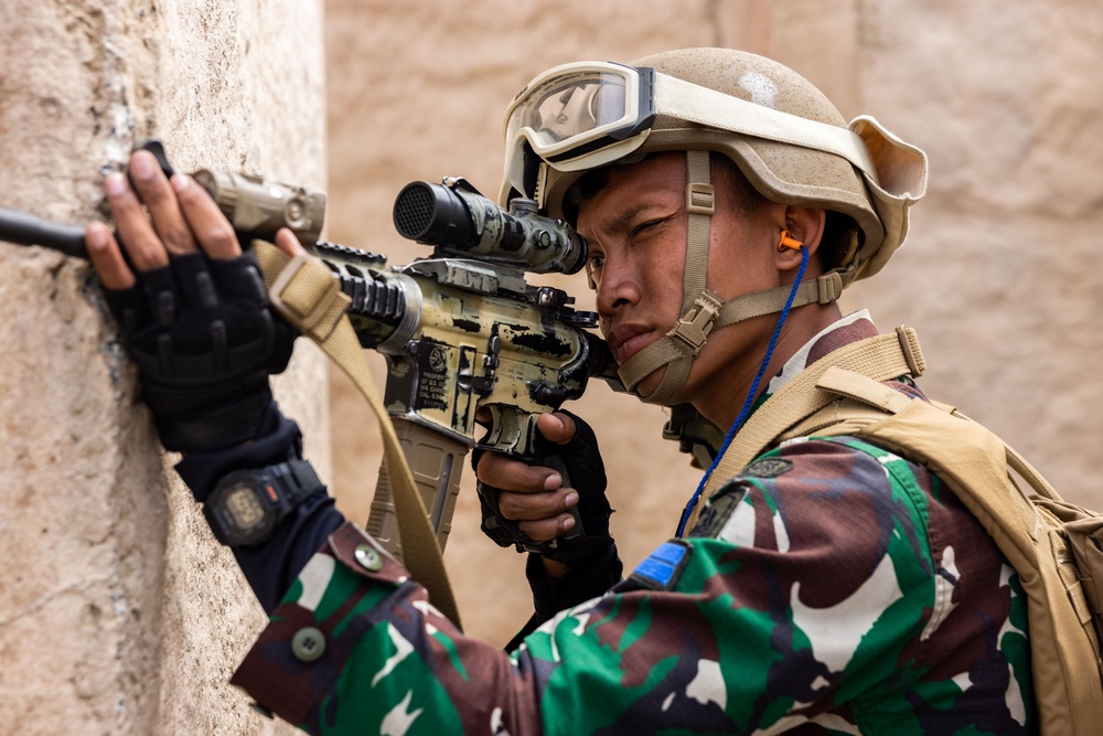 U.S. Marines and Indonesian Korps Marinir perform air raids at the infantry immersion trainer