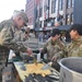 Soldiers volunteer during Western Heritage Street Breakfast