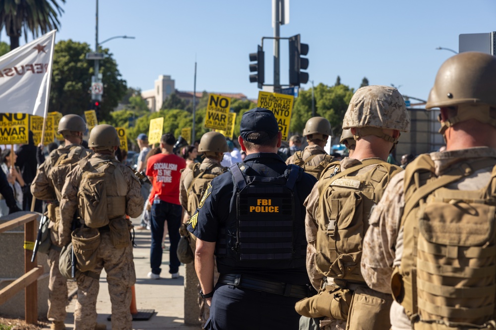 U.S. Marines, Department of Homeland Security police, FBI police guard federal building