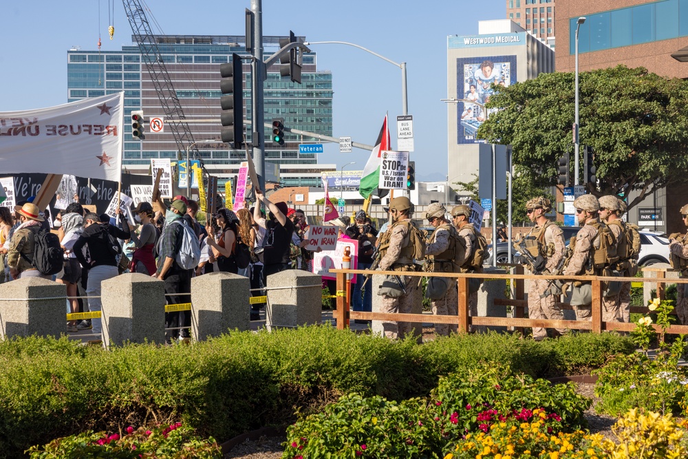 U.S. Marines, Department of Homeland Security police, FBI police guard federal building