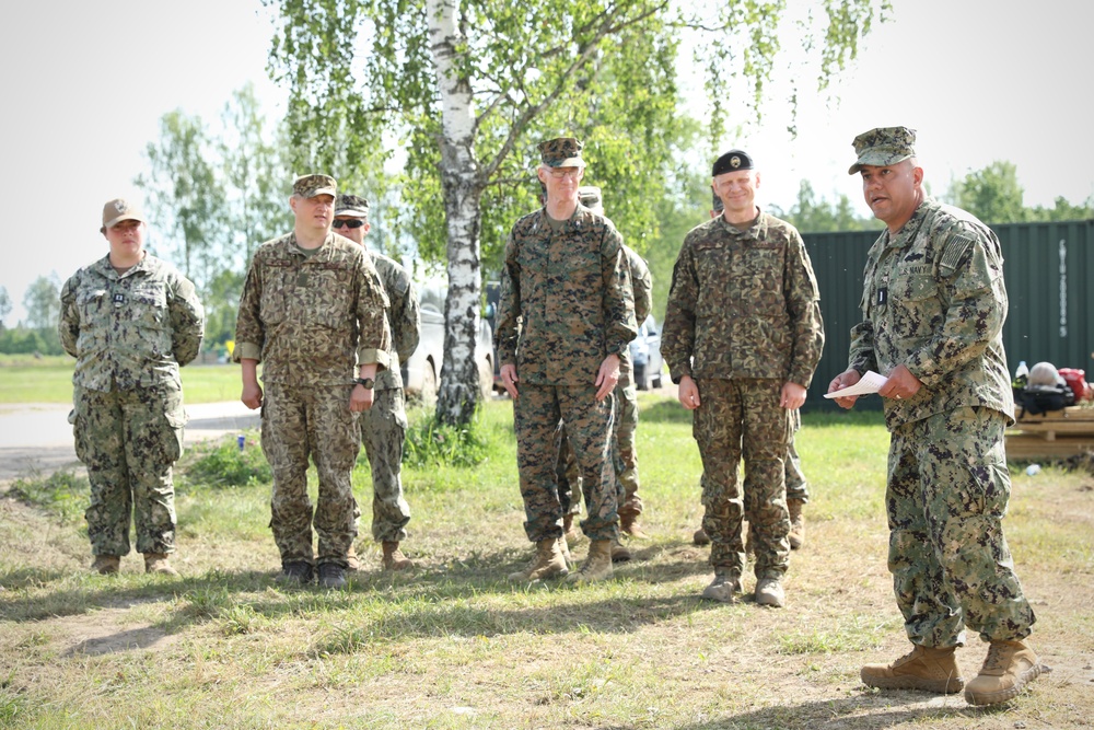 U.S., Latvian Forces Commemorate Hut Completion During BALTOPS 25