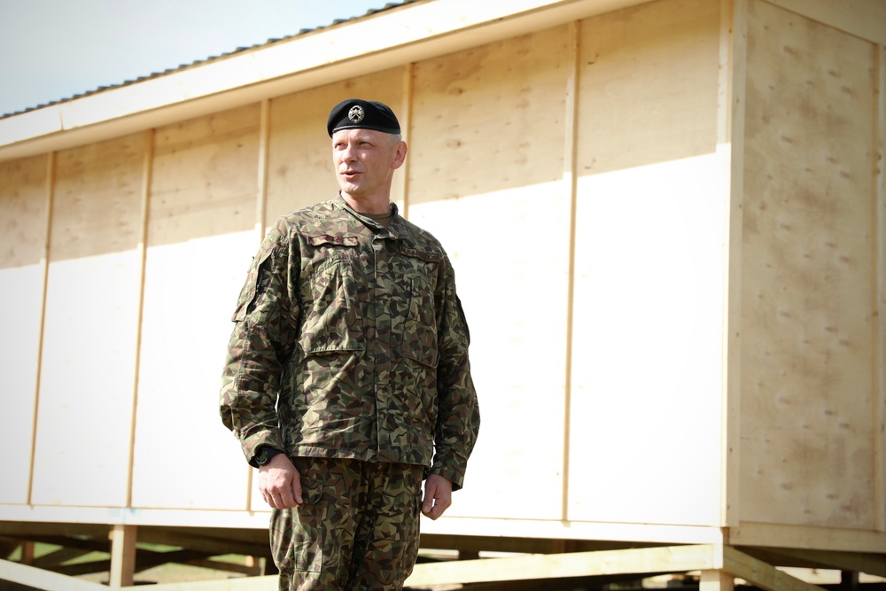 U.S., Latvian Forces Commemorate Hut Completion During BALTOPS 25