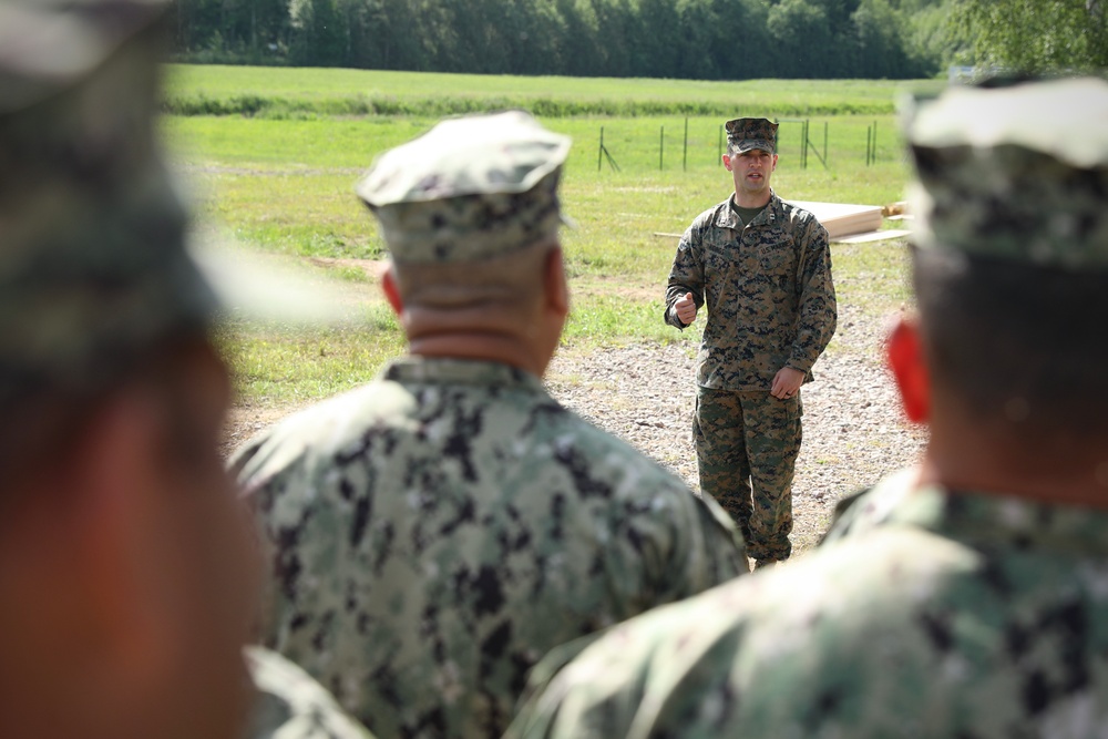 U.S., Latvian Forces Commemorate Hut Completion During BALTOPS 25