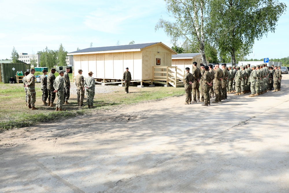 U.S., Latvian Forces Commemorate Hut Completion During BALTOPS 25