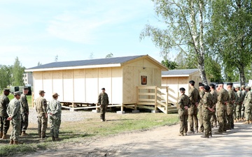 U.S., Latvian Forces Commemorate Hut Completion During BALTOPS 25