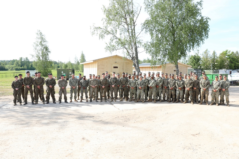 U.S., Latvian Forces Commemorate Hut Completion During BALTOPS 25