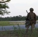 Soldier surveys terrain before base defense at JRTC