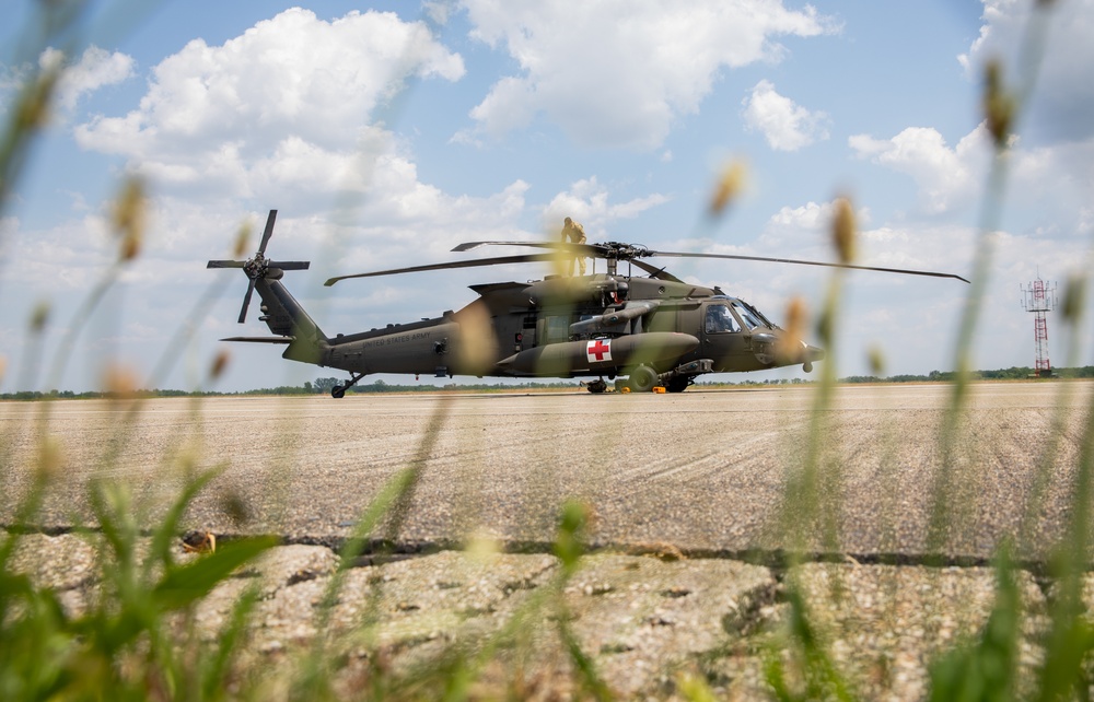 12th Combat Aviation Brigade Soldiers conduct MEDEVAC hoist training with a UH-60 Black Hawk helicopter