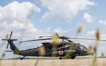 12th Combat Aviation Brigade Soldiers conduct MEDEVAC hoist training with a UH-60 Black Hawk helicopter