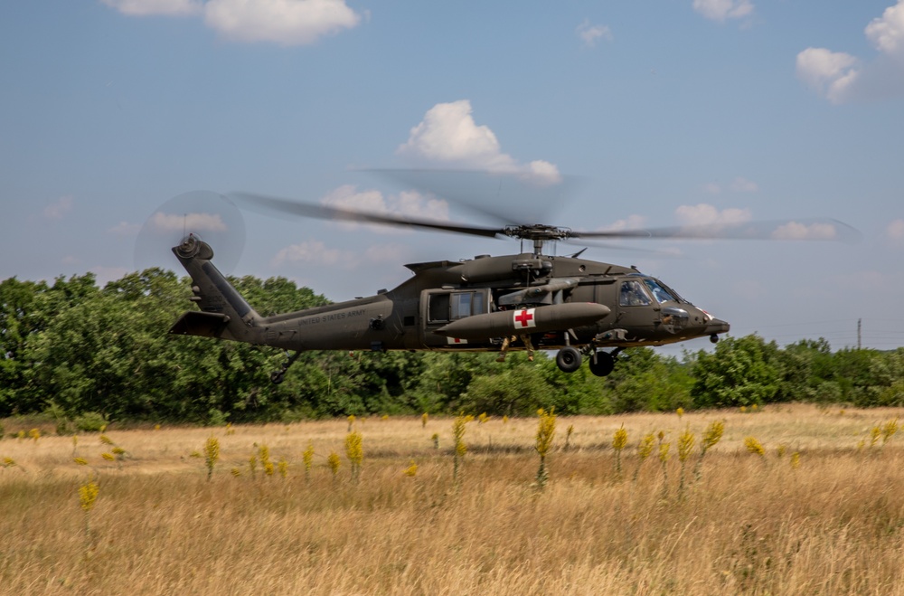 12th Combat Aviation Brigade Soldiers conduct MEDEVAC hoist training with a UH-60 Black Hawk helicopter