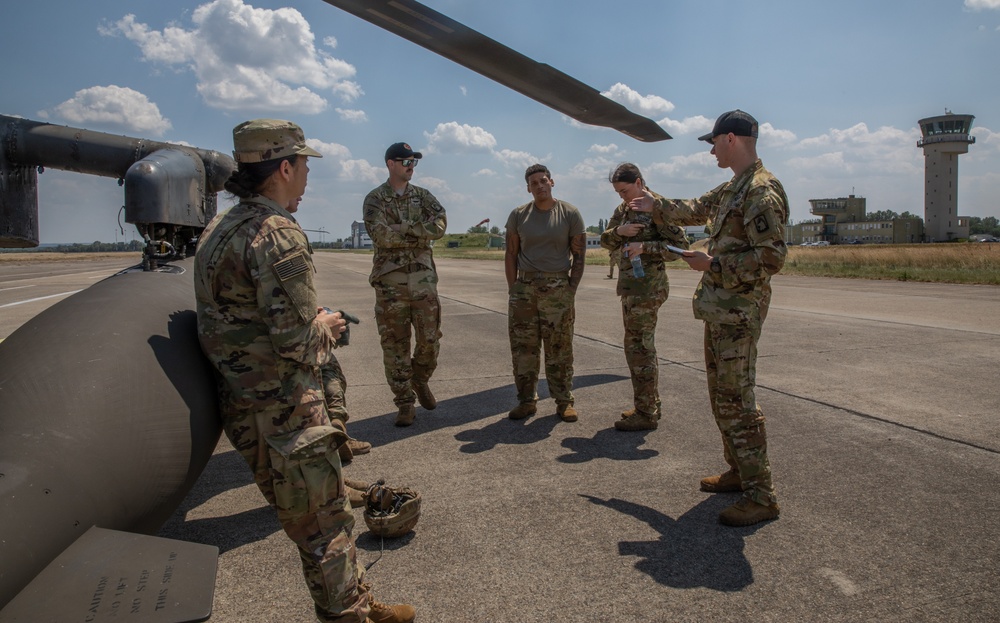 12th Combat Aviation Brigade Soldiers conduct MEDEVAC hoist training with a UH-60 Black Hawk helicopter