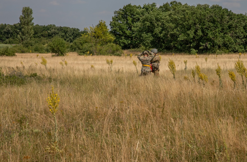 12th Combat Aviation Brigade Soldiers conduct MEDEVAC hoist training with a UH-60 Black Hawk helicopter