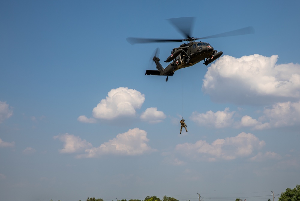 12th Combat Aviation Brigade Soldiers conduct MEDEVAC hoist training with a UH-60 Black Hawk helicopter