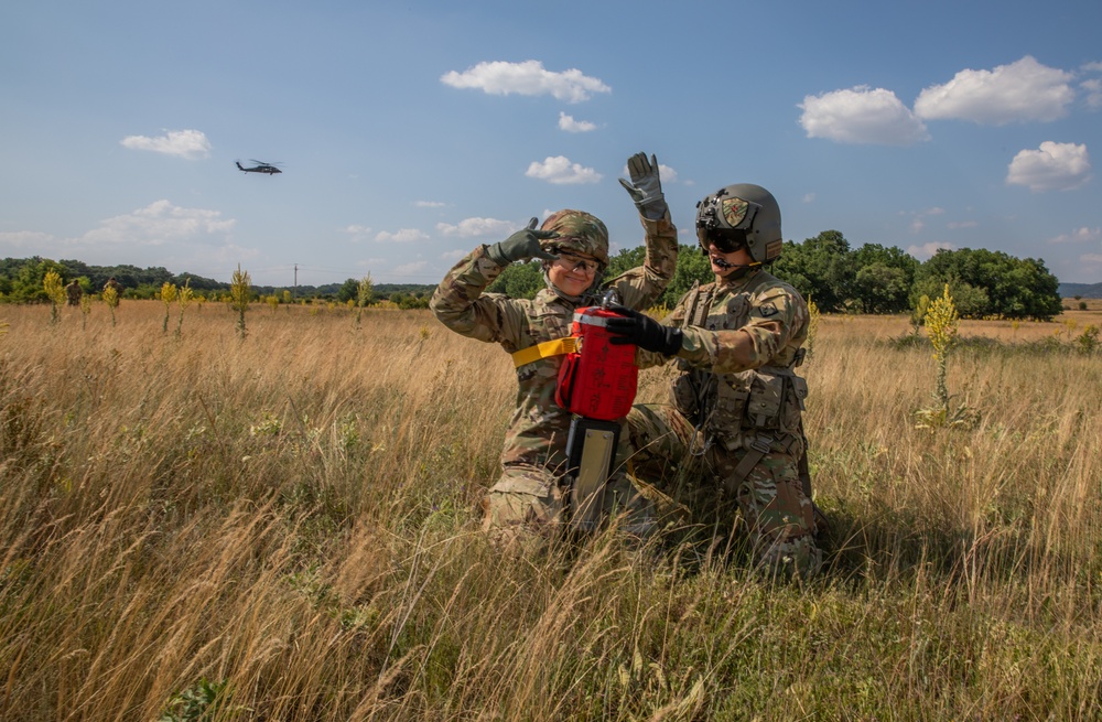 12th Combat Aviation Brigade Soldiers conduct MEDEVAC hoist training with a UH-60 Black Hawk helicopter