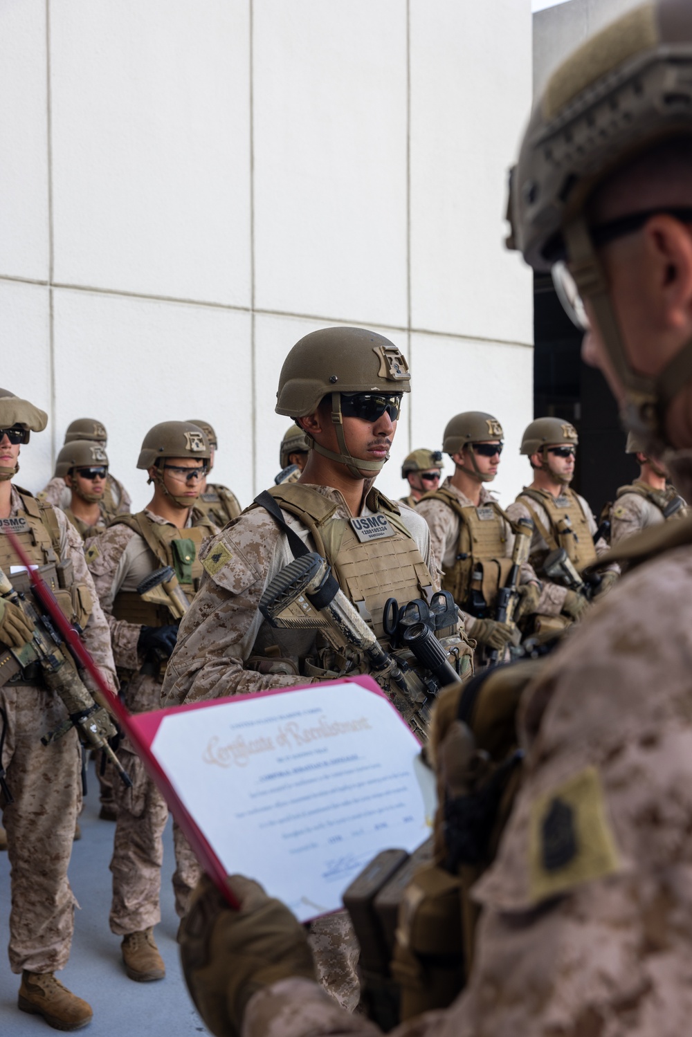 U.S. Marine reenlists at federal building