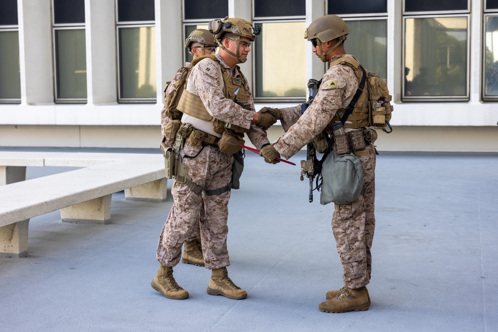 U.S. Marine reenlists at federal building